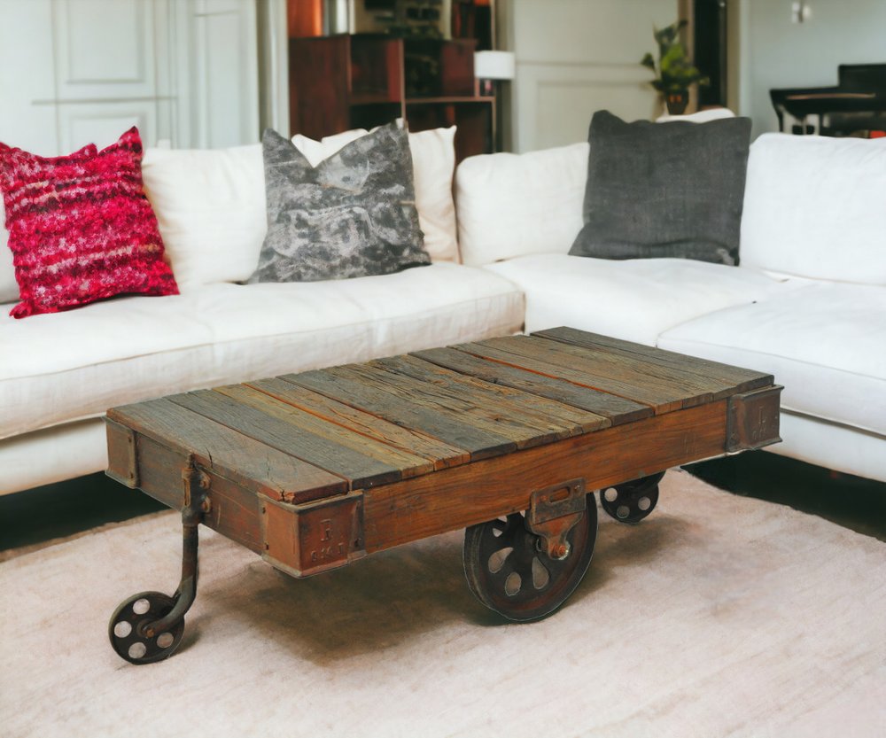50" Brown and Black Solid Wood and Iron Distressed Wheel Coffee Table