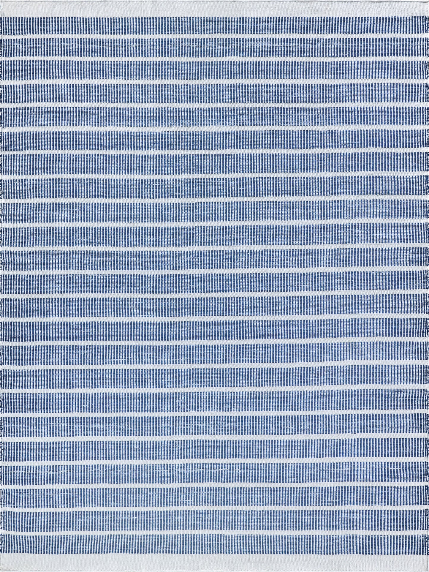 Blue and white striped flat-weave rug; indoor/outdoor use, 2' x 3'.