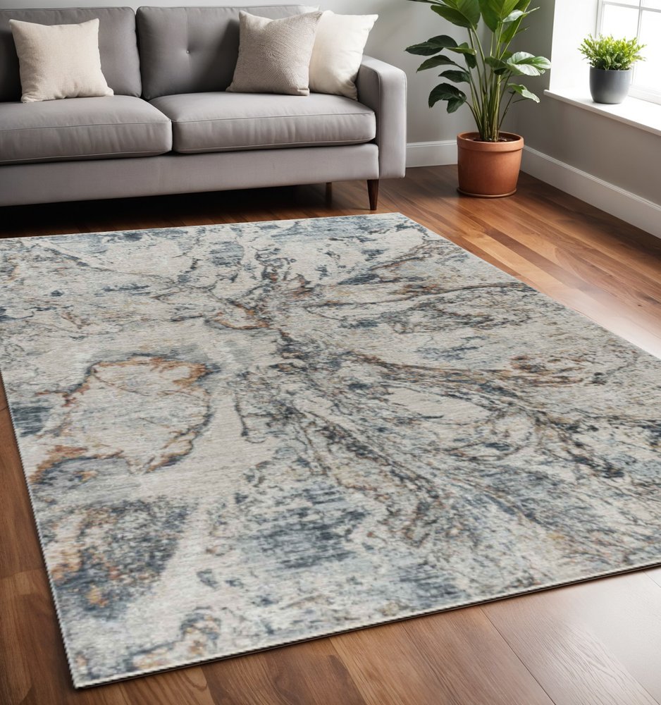 5' X 8' Beige and Blue Abstract Power Loom Area Rug