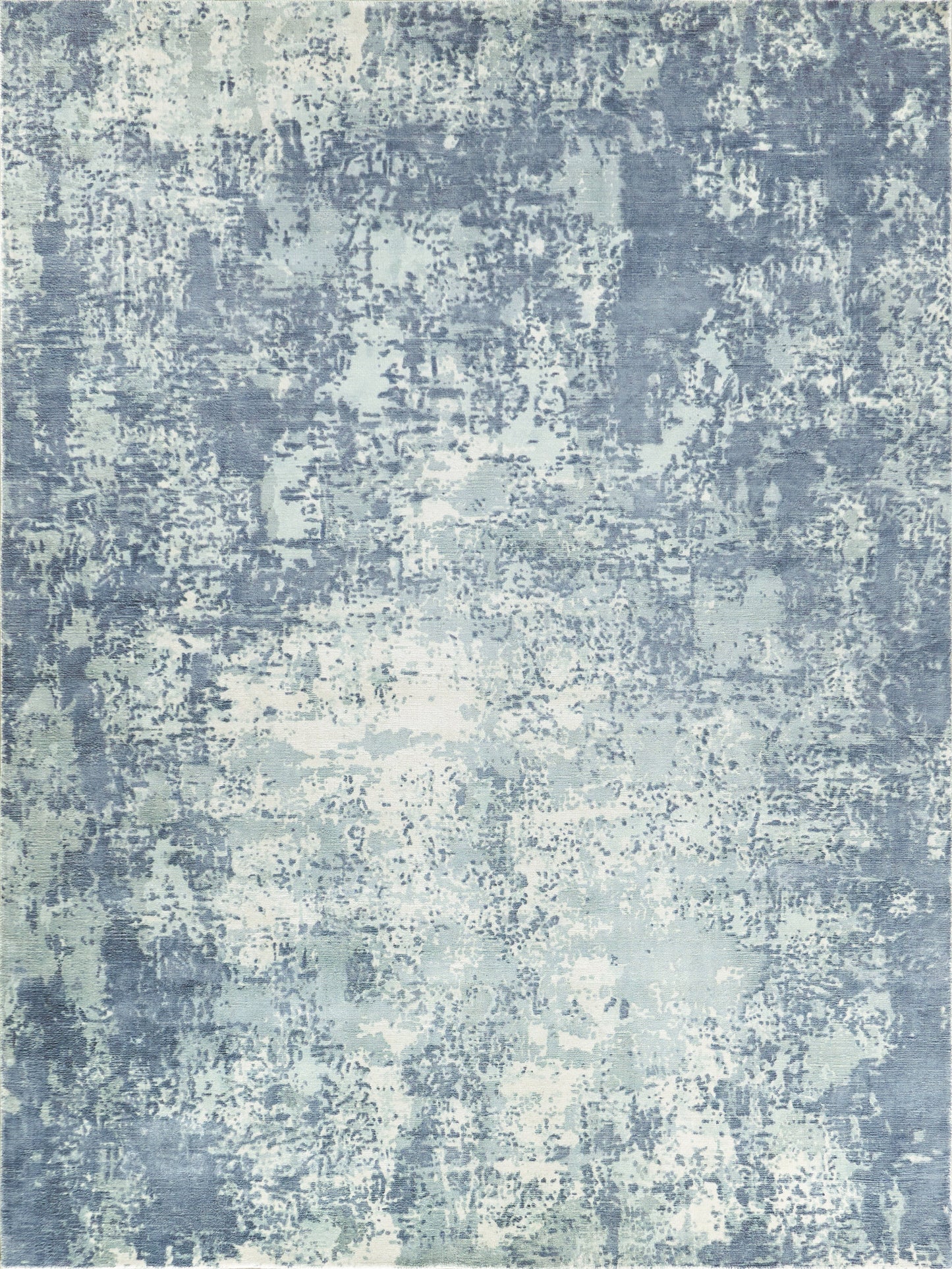Blue-gray abstract rug with a distressed, mottled pattern and washed texture; indoor hand-loomed rug, 6' x 9'.