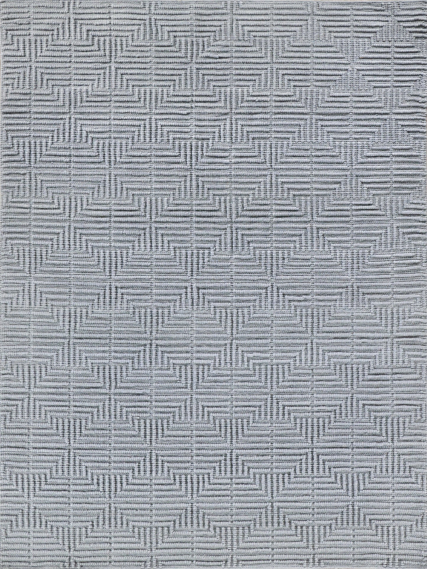 Light gray rug with repeating geometric star-square motif, textured jacquard-style weave.
