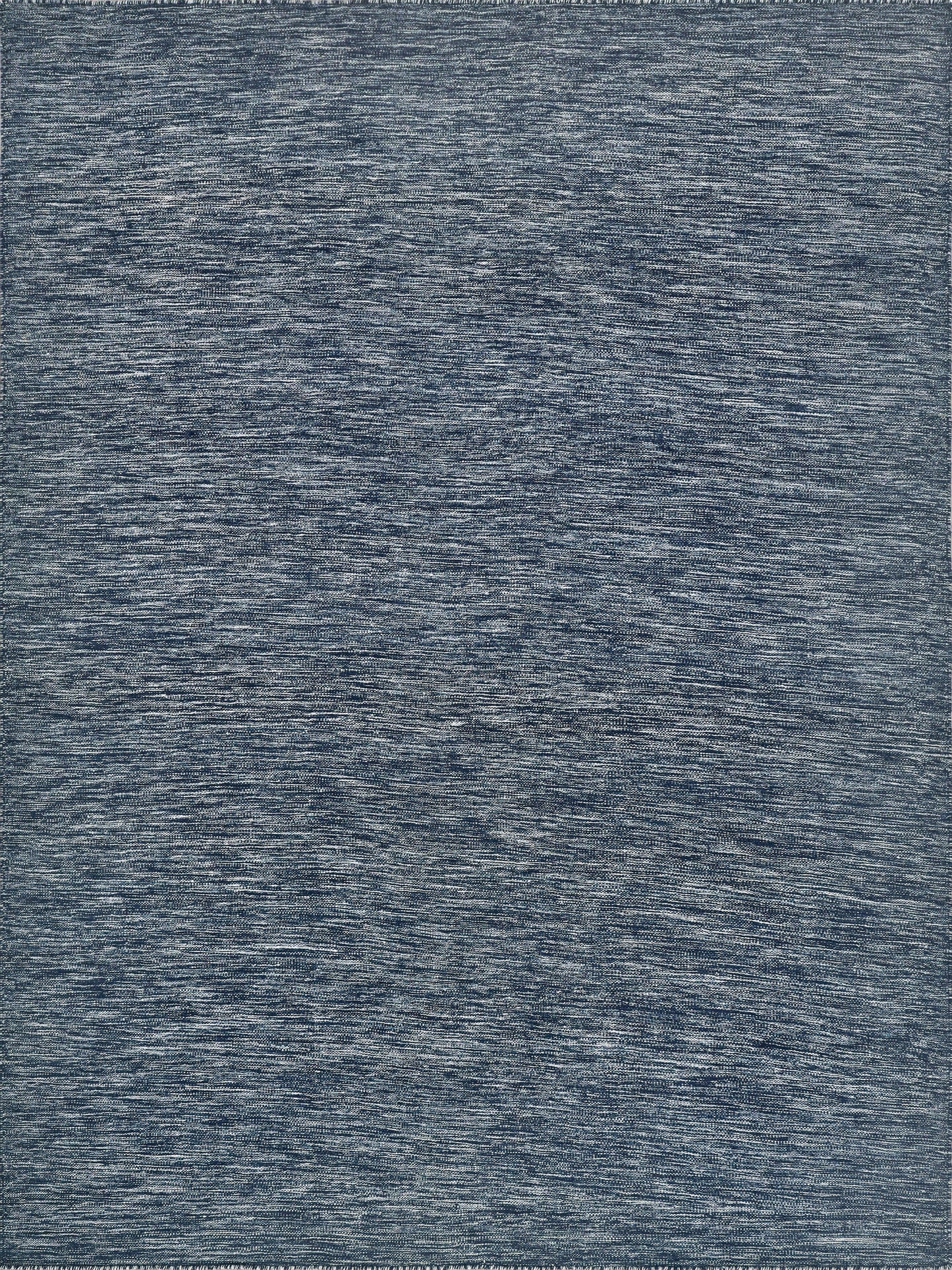 Flatweave rectangle rug in varying shades of blue with a soft, heathered texture.