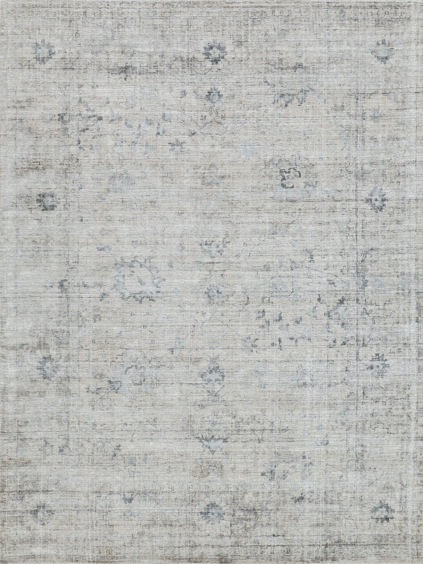 Light gray-beige distressed area rug with subtle blue faded motifs and a vintage oriental-inspired design.