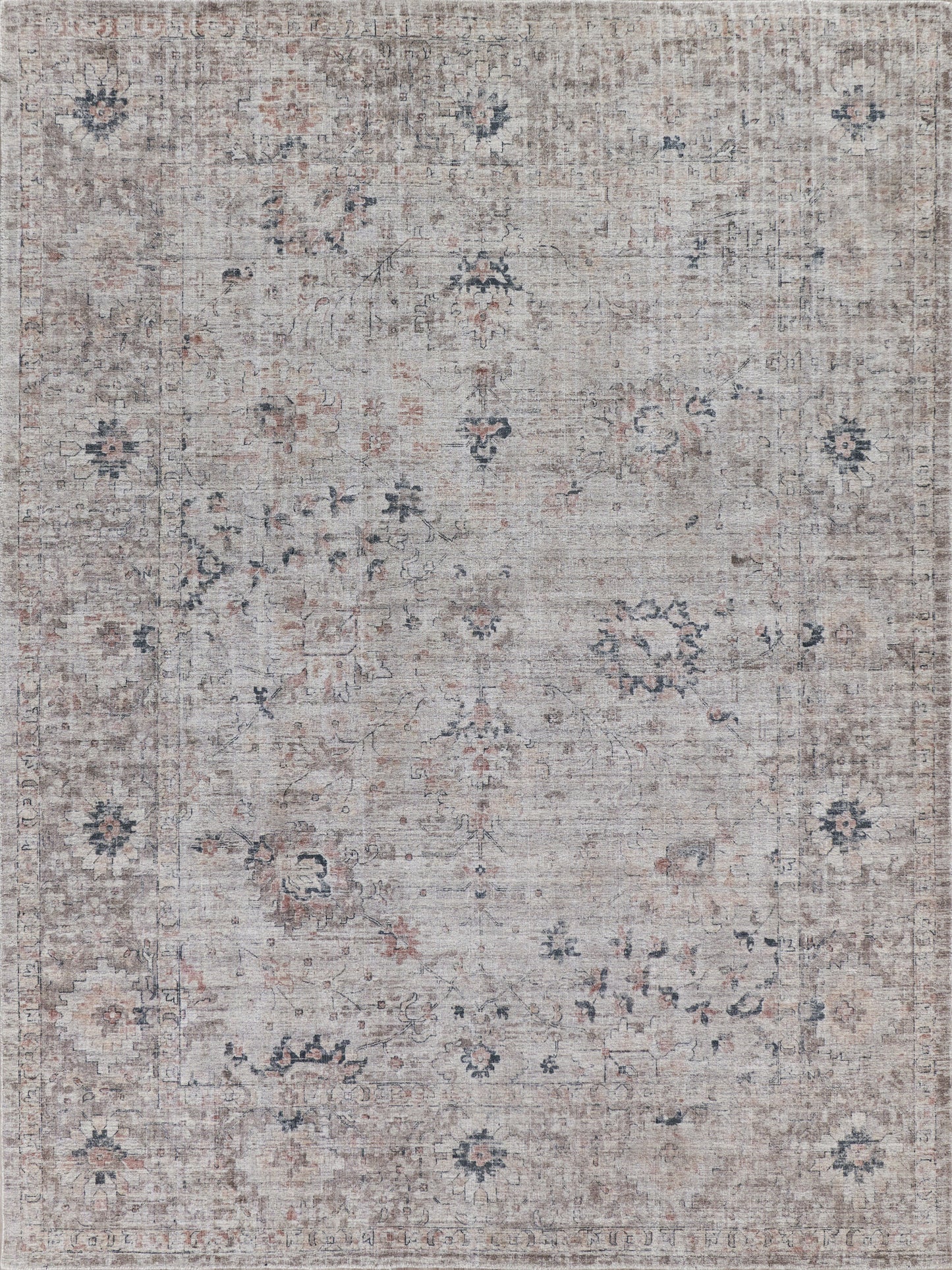 Muted beige & gray handloomed rectangle area rug with floral patterns in soft pink & navy. Worn, vintage style complements various decor.