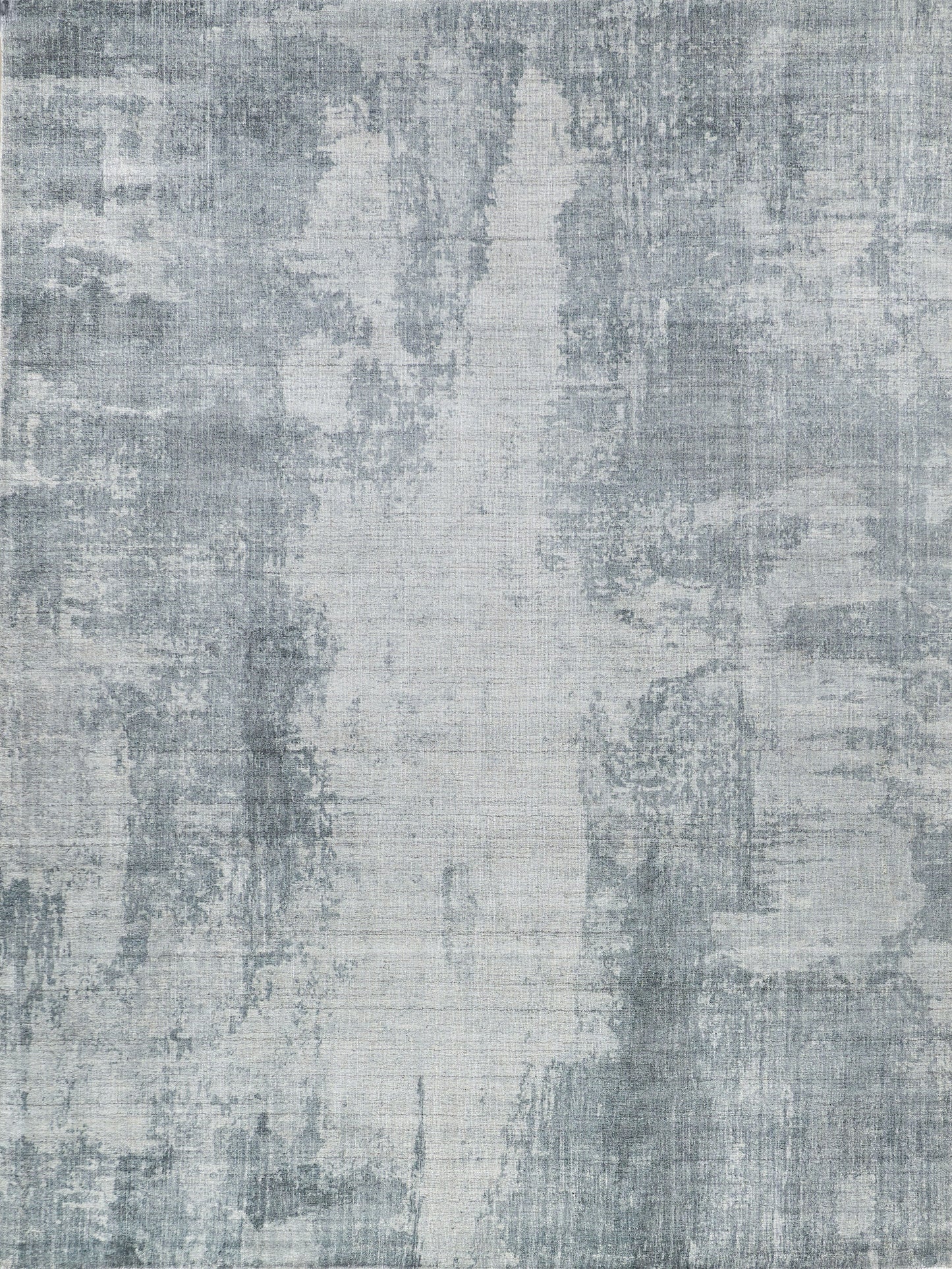 Rectangular blue-gray abstract rug with distressed, painterly pattern for modern living rooms.