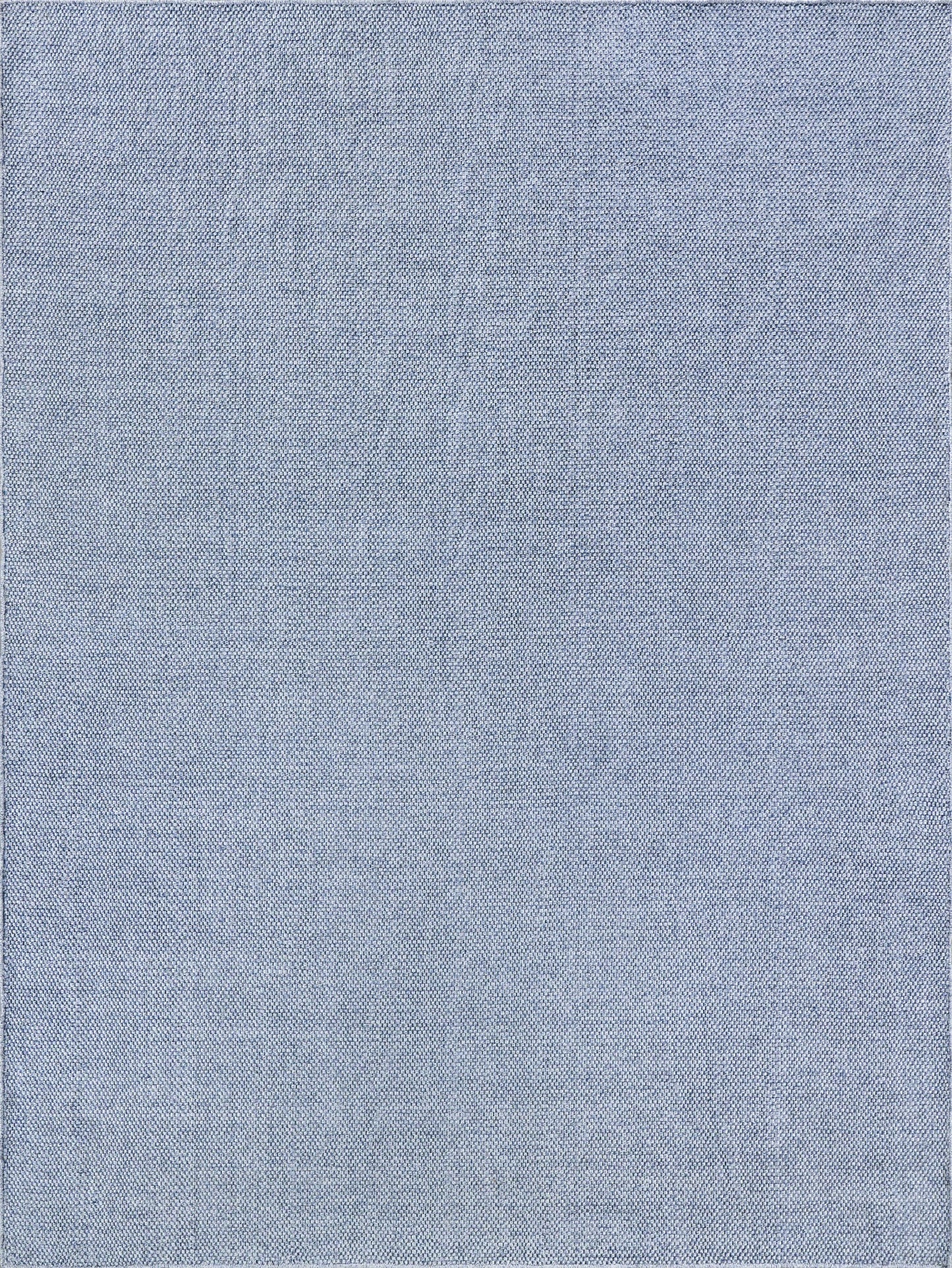 Light blue-gray flatweave rug with visible threads and subtle wrinkles.