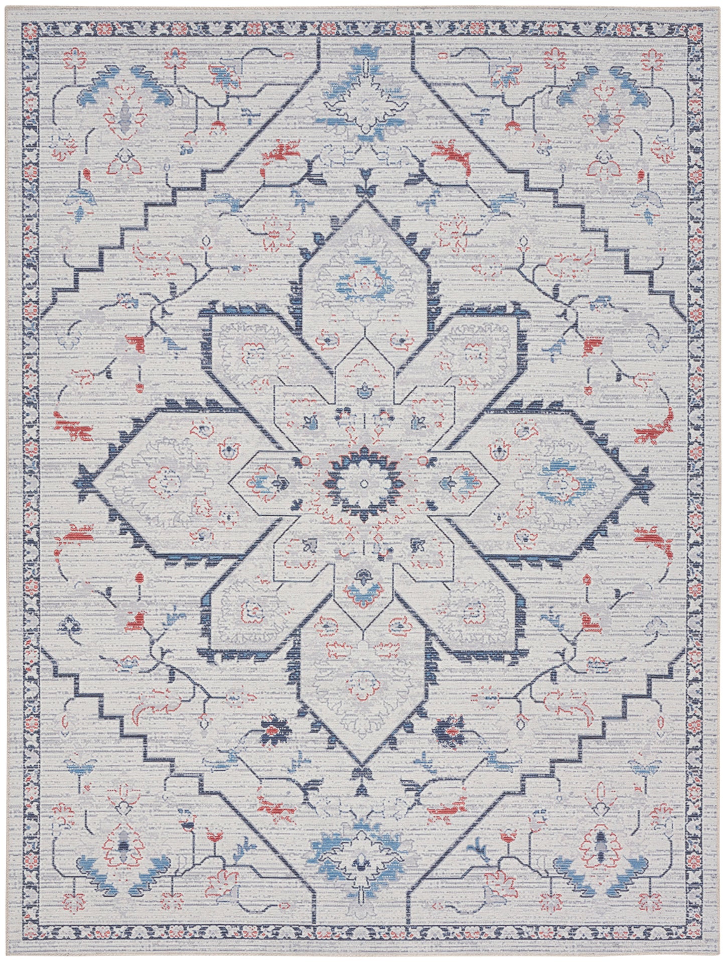 Light gray-blue oriental rug with a bold navy central star medallion, pale blue and coral floral accents, rectangular.