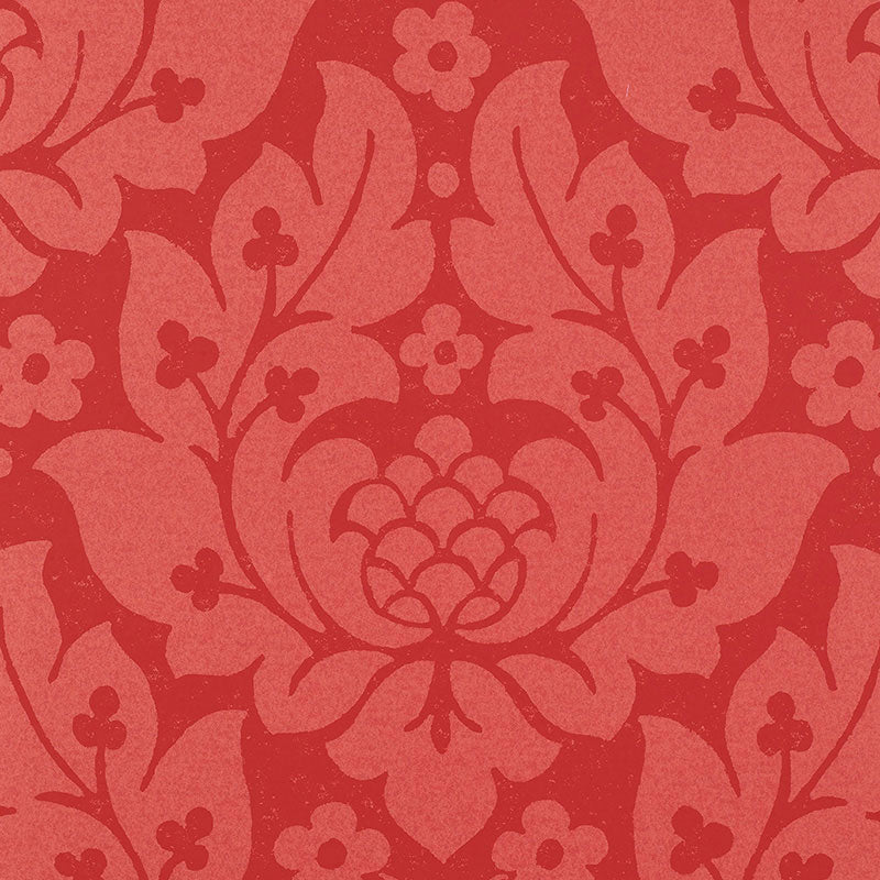 Two-tone red damask wallpaper with ornate floral motif and scrolling vines.