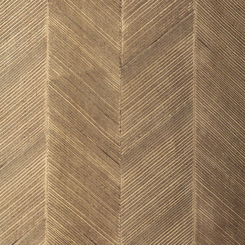 Golden-brown chevron texture on grasscloth wallcovering with diagonal lines forming a V pattern.