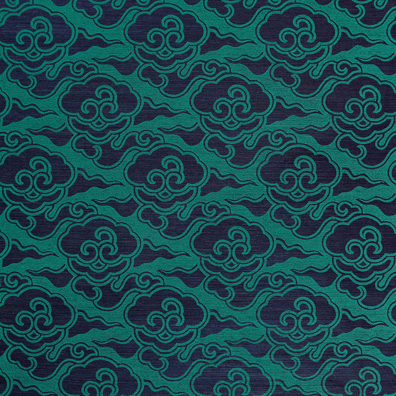 Teal fabric with dark navy cloud-wave pattern in a repeating ornamental textile design.