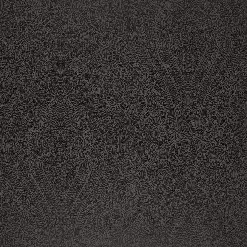 Dark charcoal gradient backdrop; studio shot of charcoal paisley fabric swatch with subtle texture.