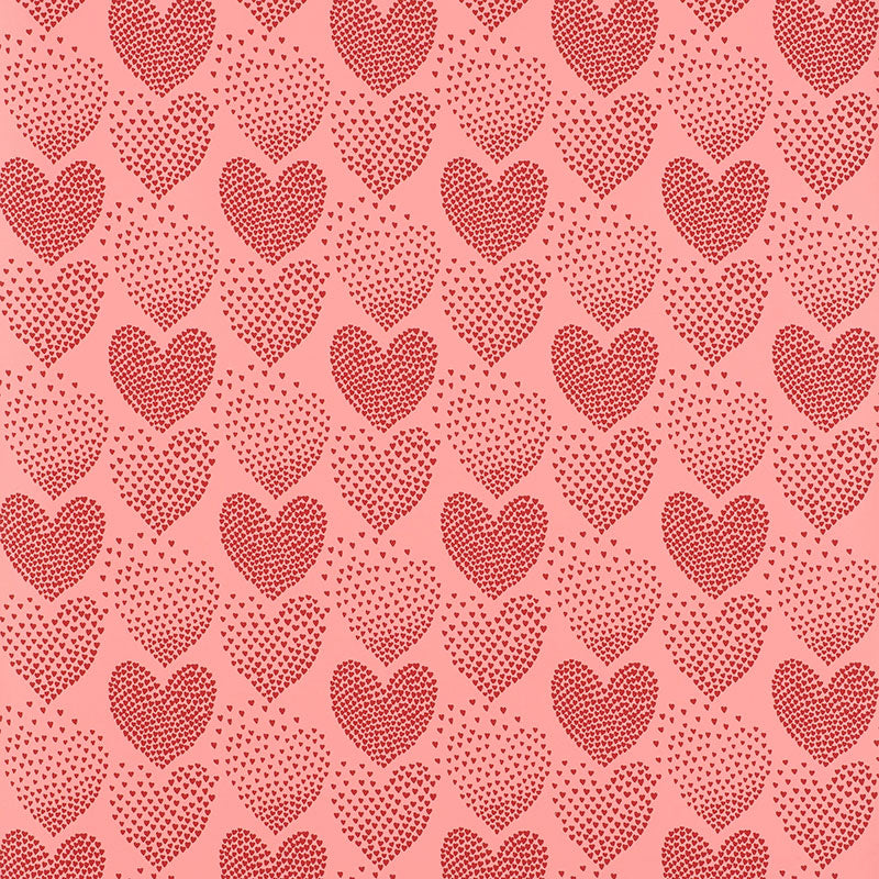 Repeating red heart pattern with dotted fill on pink background; romantic textile or wallpaper design.