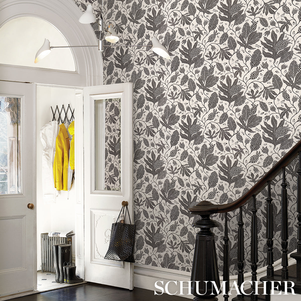 Black and cream wallpaper with a bold dotted pattern.