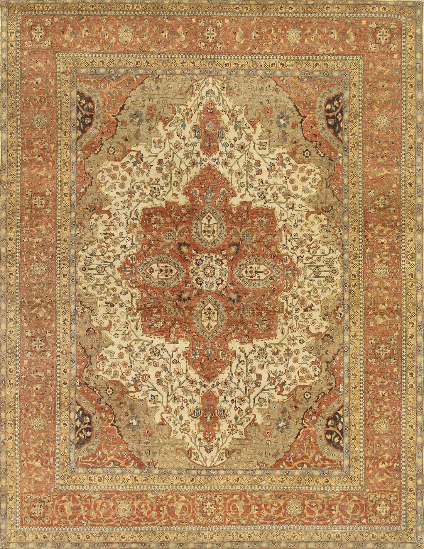 Intricate red and beige patterned area rug featuring floral motifs and a central medallion, framed by ornate borders.