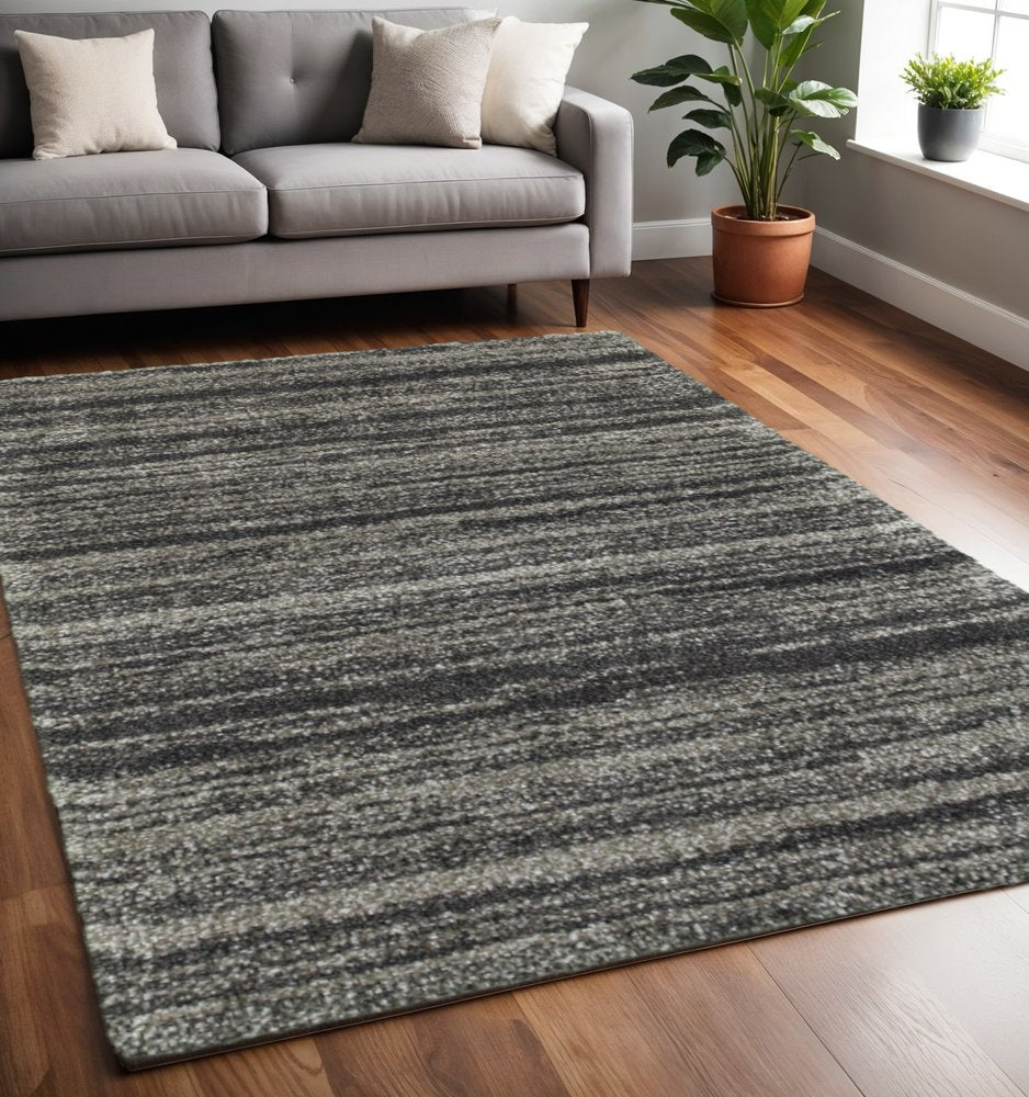 5' X 8' Charcoal Silver And Grey Geometric Shag Power Loom Stain Resistant Area Rug