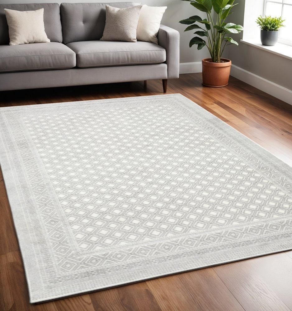 5' X 8' White And Grey Oriental Power Loom Stain Resistant Area Rug