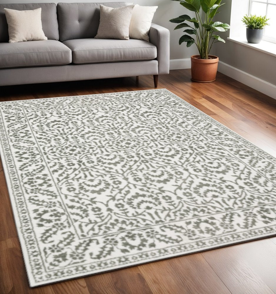 5' X 8' Grey And White Floral Power Loom Stain Resistant Area Rug