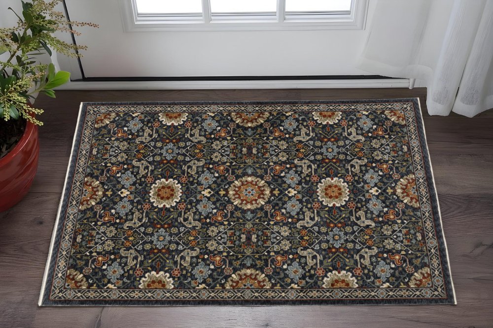 3' X 5' Blue Red Ivory And Gold Oriental Power Loom Stain Resistant Area Rug With Fringe