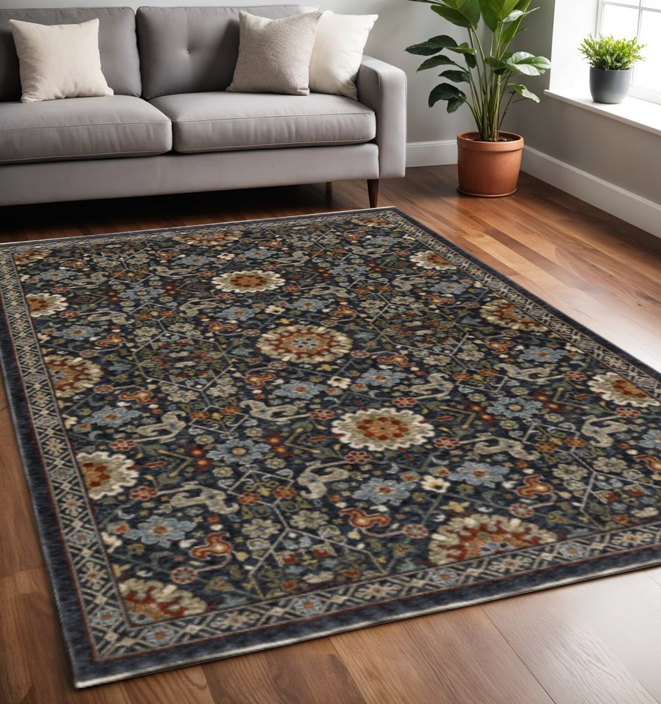 5' X 8' Blue Red Ivory And Gold Oriental Power Loom Stain Resistant Area Rug With Fringe