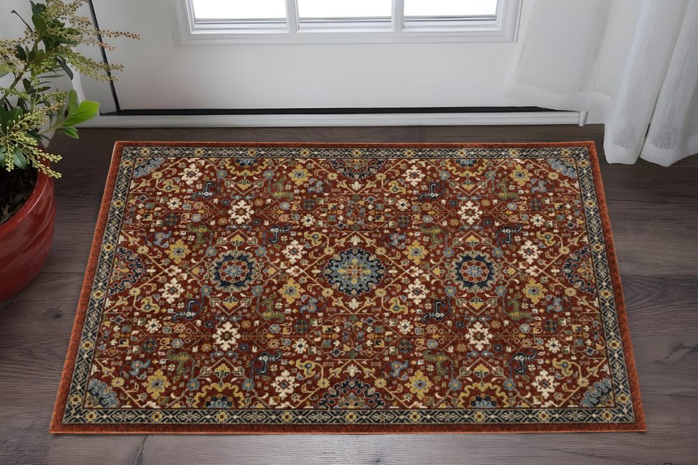 2' X 3' Red Blue Gold And Ivory Oriental Power Loom Stain Resistant Area Rug With Fringe