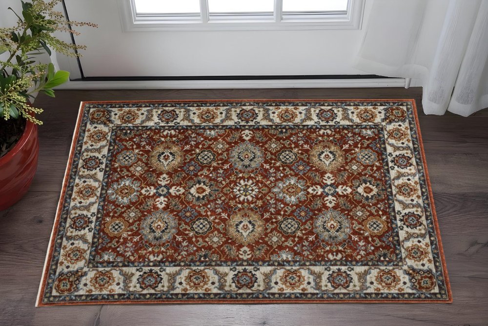 3' X 5' Red Blue Ivory Gold And Navy Oriental Power Loom Stain Resistant Area Rug With Fringe