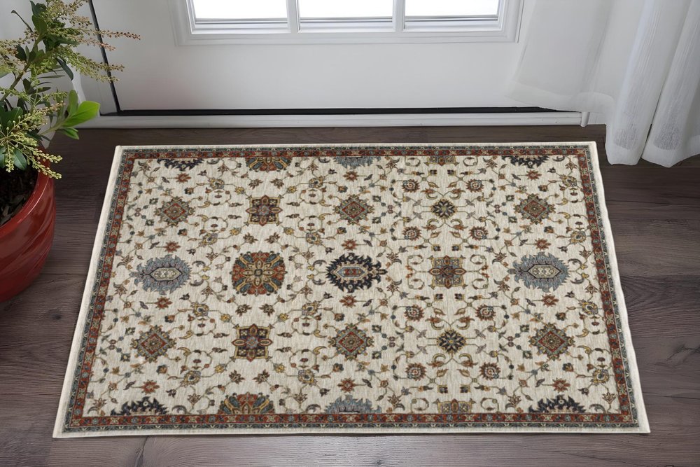 3' X 5' Beige Rust Red Blue Gold And Grey Oriental Power Loom Stain Resistant Area Rug With Fringe