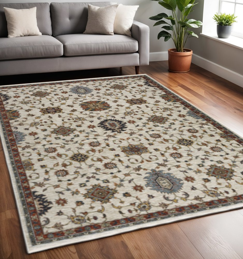 5' X 8' Beige Rust Red Blue Gold And Grey Oriental Power Loom Stain Resistant Area Rug With Fringe