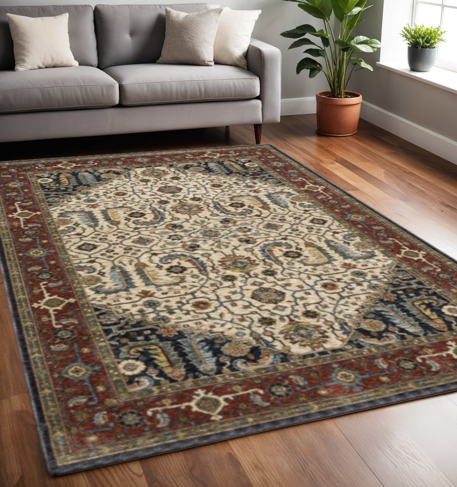 5' X 8' Ivory Beige Red Blue Gold Green And Navy Oriental Power Loom Stain Resistant Area Rug With Fringe