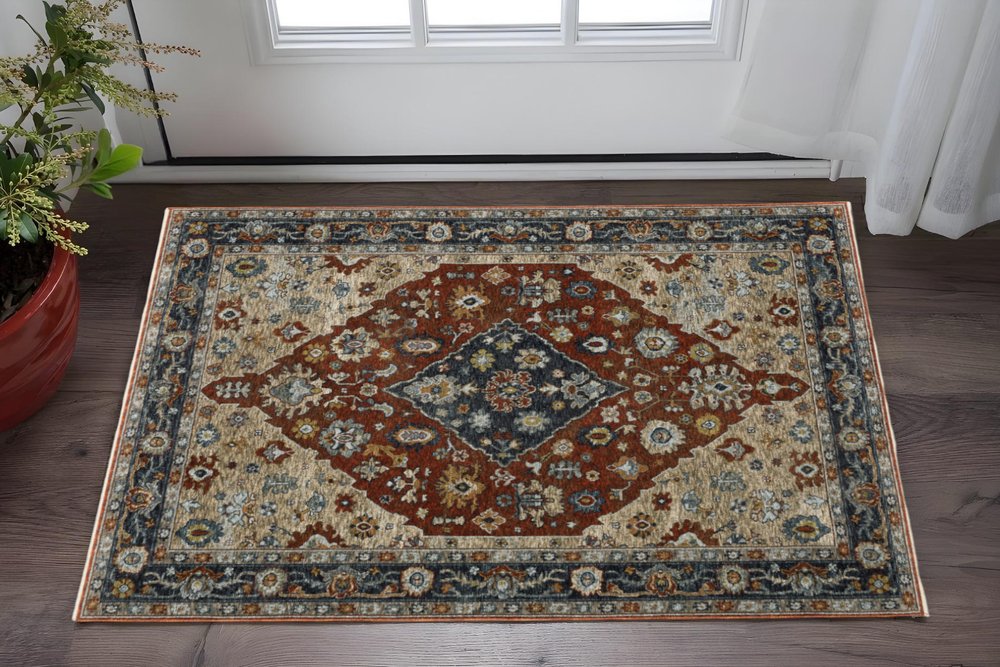 2' X 3' Blue Beige Tan Brown Gold And Rust Red Oriental Power Loom Stain Resistant Area Rug With Fringe