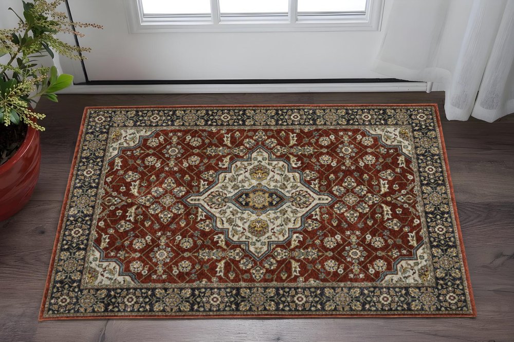 2' X 3' Red Ivory Blue Navy Gold And Grey Oriental Power Loom Stain Resistant Area Rug With Fringe