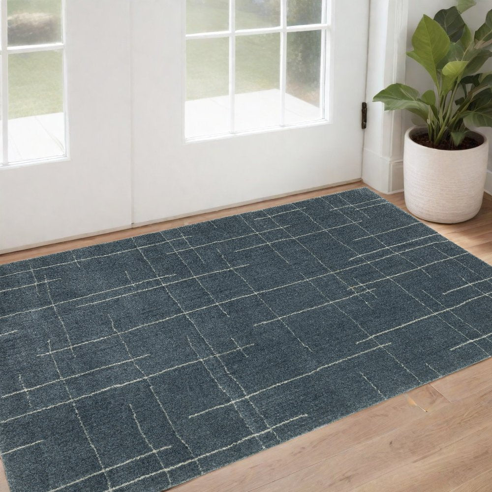 3' X 5' Blue And Beige Geometric Distressed Area Rug