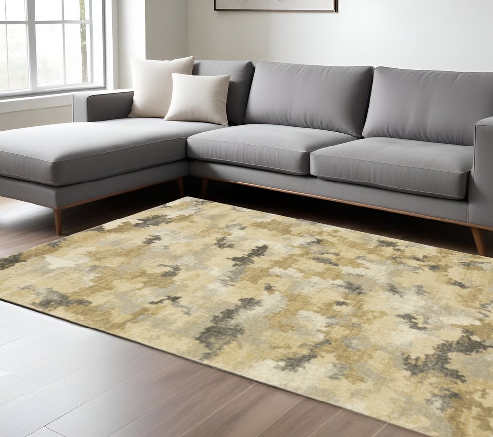6' X 9' Beige Grey And Gold Abstract Power Loom Stain Resistant Area Rug