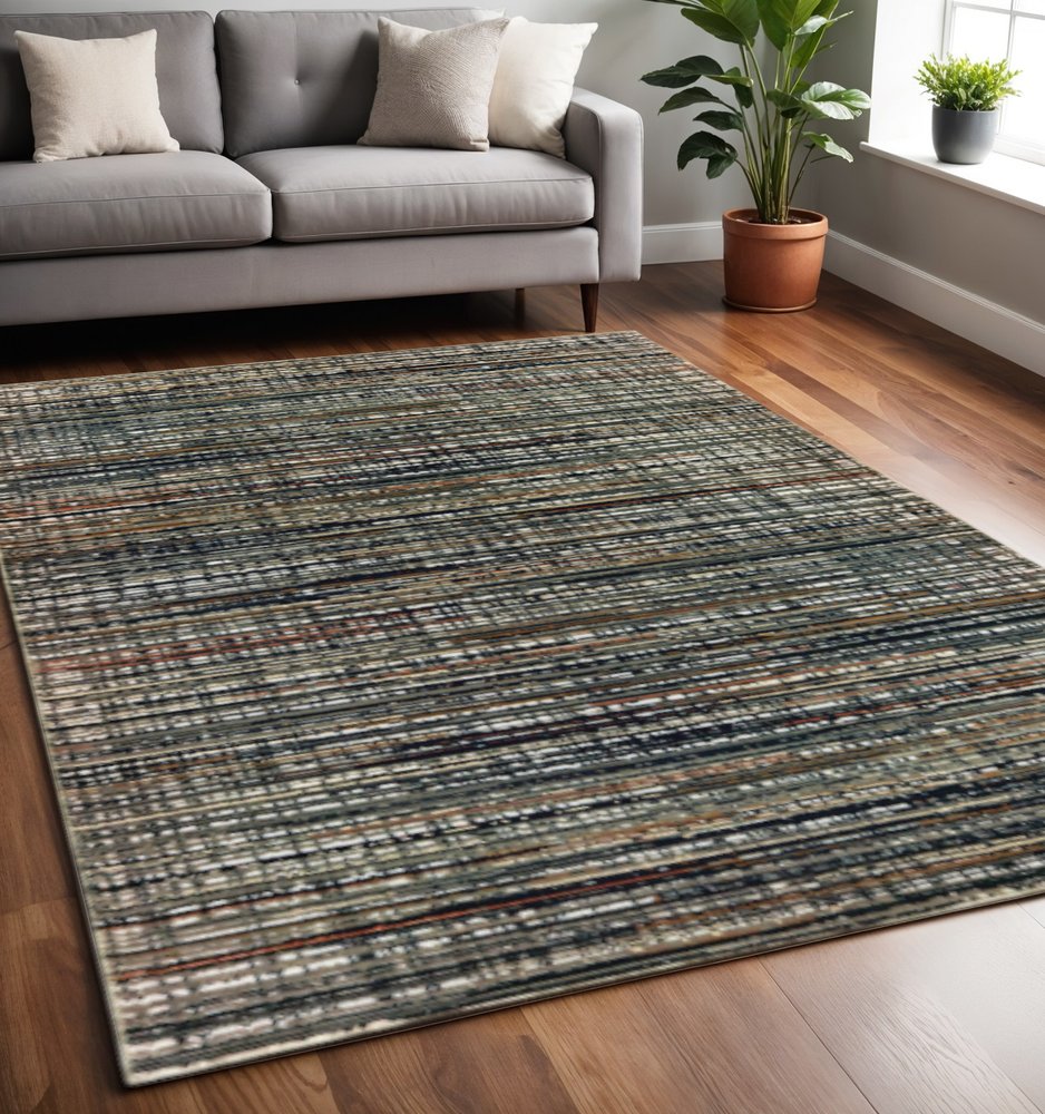5' X 8' Black Navy Gold Ivory And Blush Abstract Power Loom Stain Resistant Area Rug
