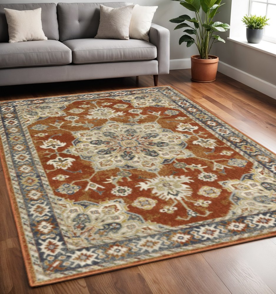 5' X 7' Rust Beige Teal Blue And Gold Oriental Power Loom Stain Resistant Area Rug