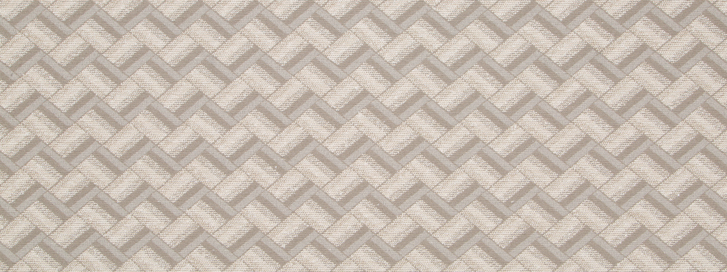 Neutral beige and taupe upholstery fabric with a repeating chevron diamond pattern and soft textured weave.