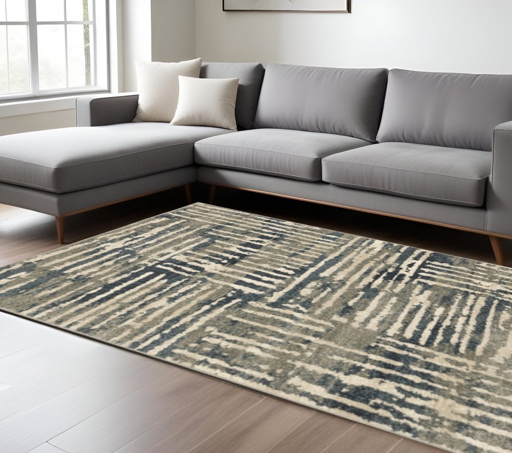 Blue and beige abstract shag area rug, 7' x 9'.