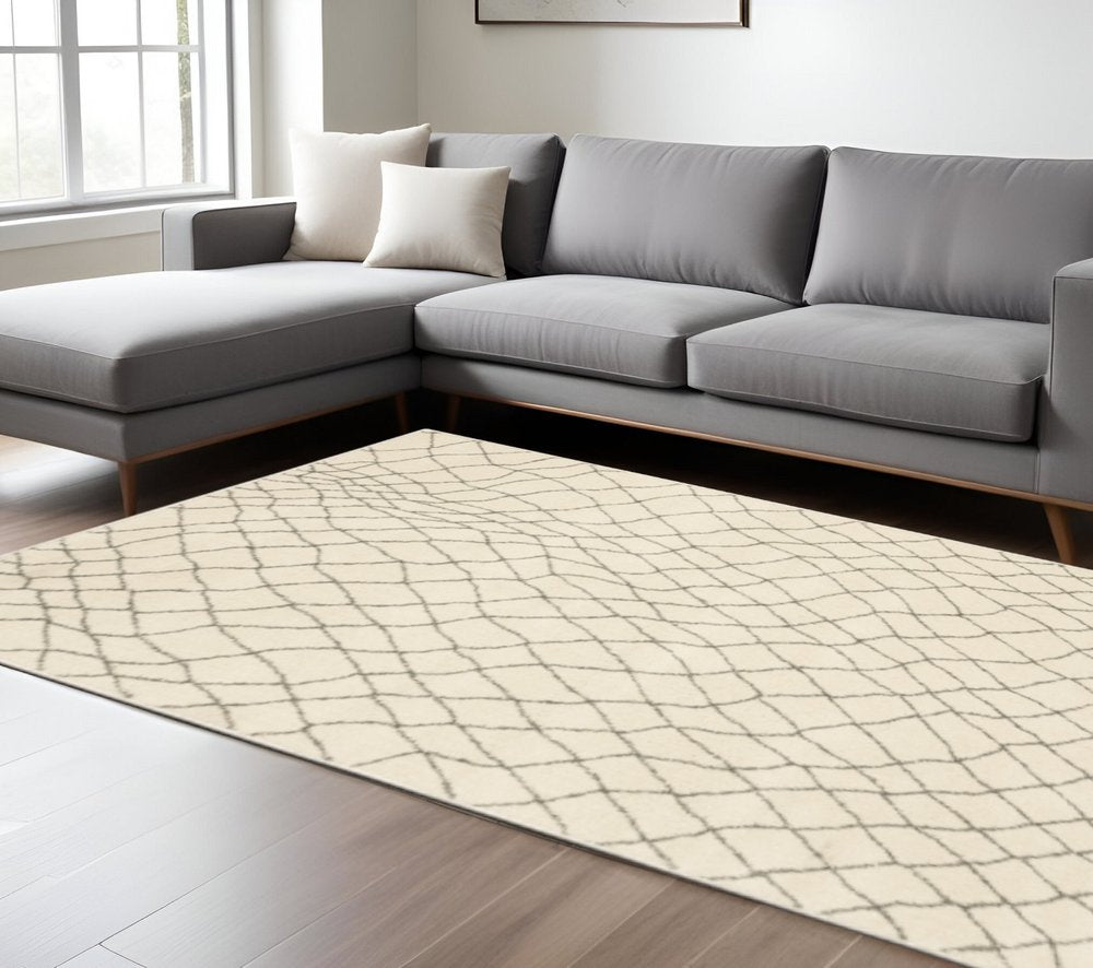 7' X 9' Gray And Ivory Geometric Shag Area Rug