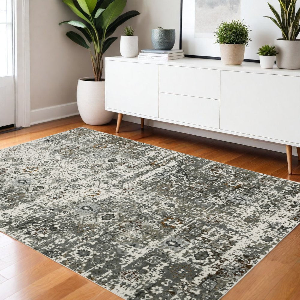 4' x 6' ivory and gray distressed oriental area rug.