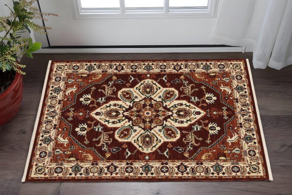 3' X 5' Red Ivory Orange And Blue Oriental Power Loom Stain Resistant Area Rug With Fringe