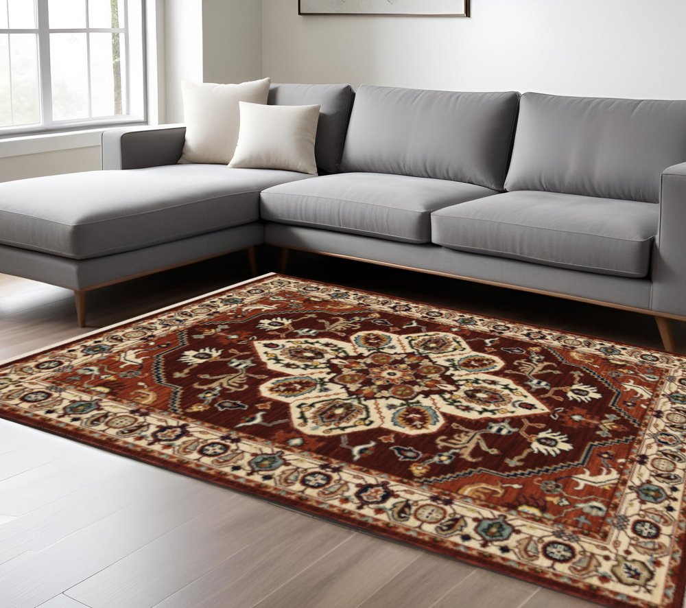 10' X 13' Red Ivory Orange And Blue Oriental Power Loom Stain Resistant Area Rug With Fringe