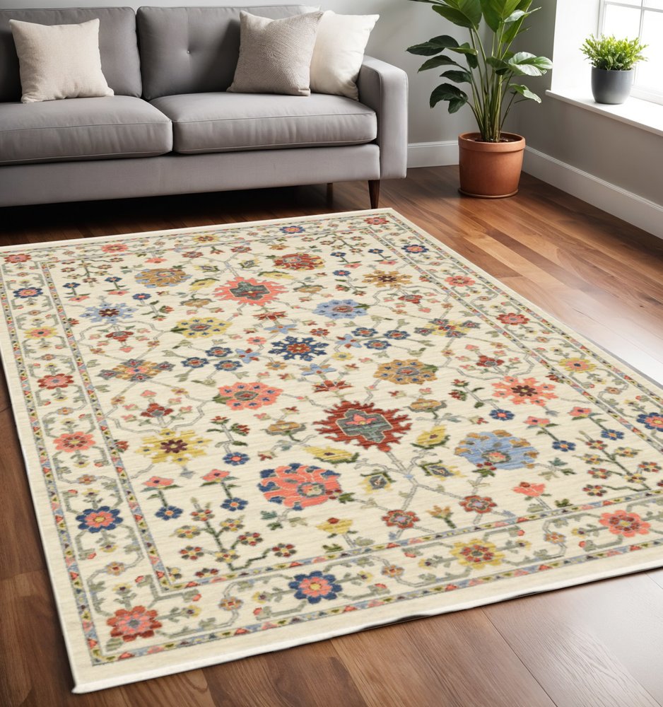 5' X 8' Ivory Blue And Red Oriental Area Rug With Fringe