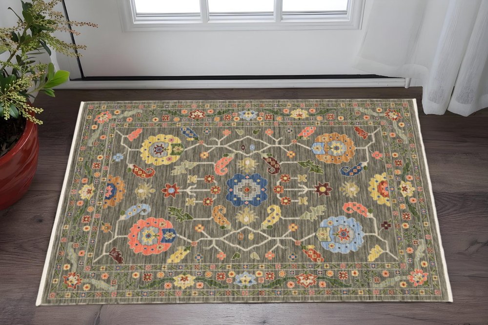 3' X 5' Grey Blue Pink Orange Rust Red Green And Ivory Oriental Power Loom Stain Resistant Area Rug With Fringe