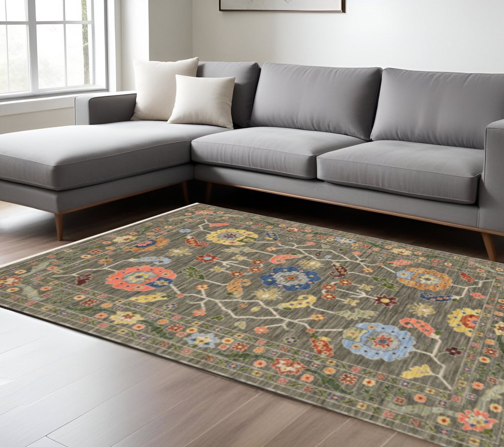 8' X 11' Grey Blue Pink Orange Rust Red Green And Ivory Oriental Power Loom Stain Resistant Area Rug With Fringe