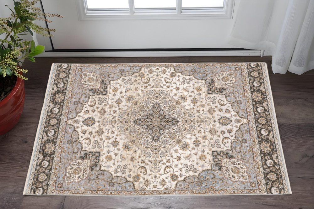 3' X 5' Ivory And Blue Oriental Power Loom Stain Resistant Area Rug With Fringe