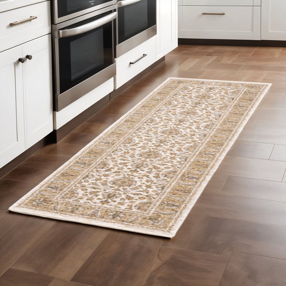 2' X 8' Ivory And Gold Oriental Power Loom Stain Resistant Runner Rug With Fringe