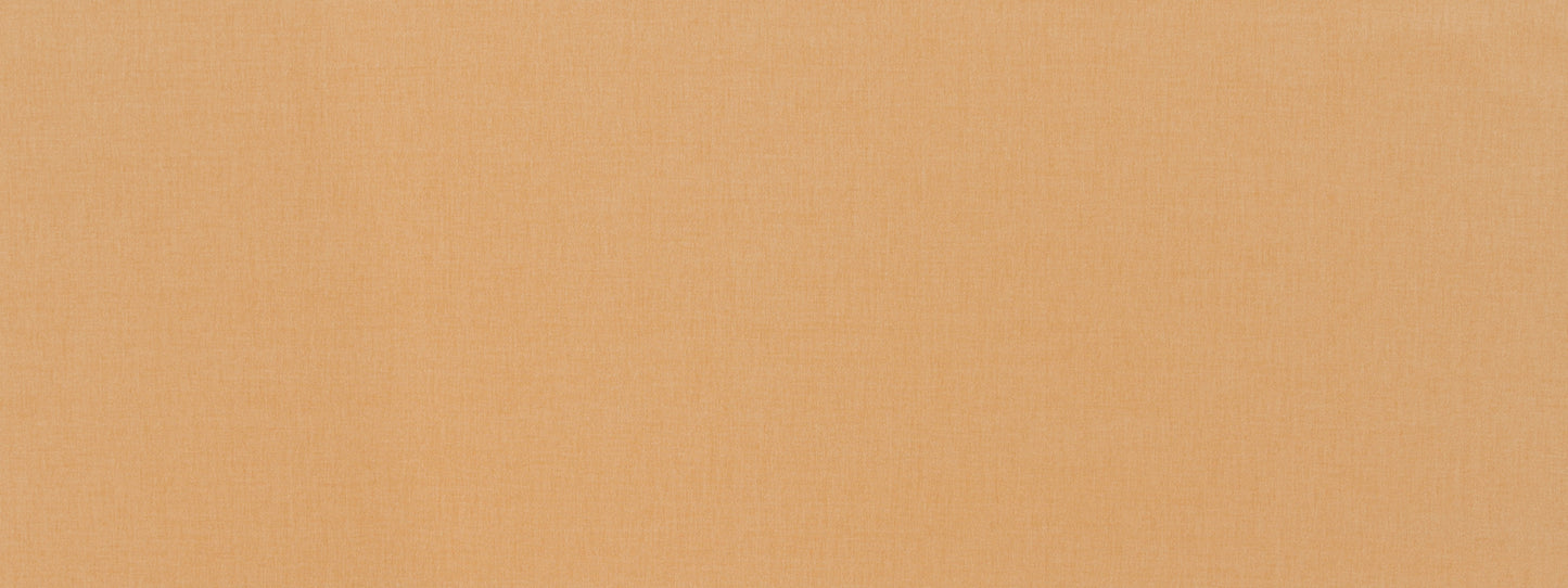 Close-up of warm peach fabric with a fine woven texture and soft beige-orange tones.