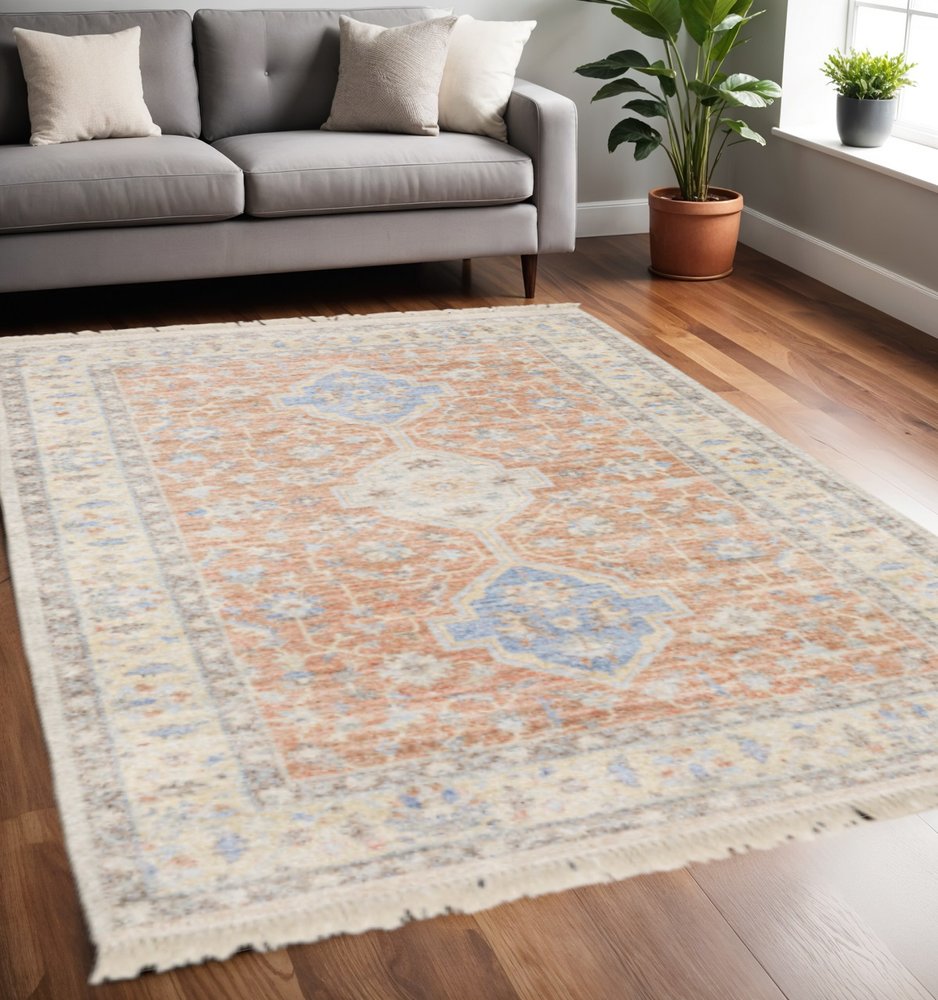 5' X 8' Orange And Blue Oriental Hand Loomed Stain Resistant Area Rug With Fringe