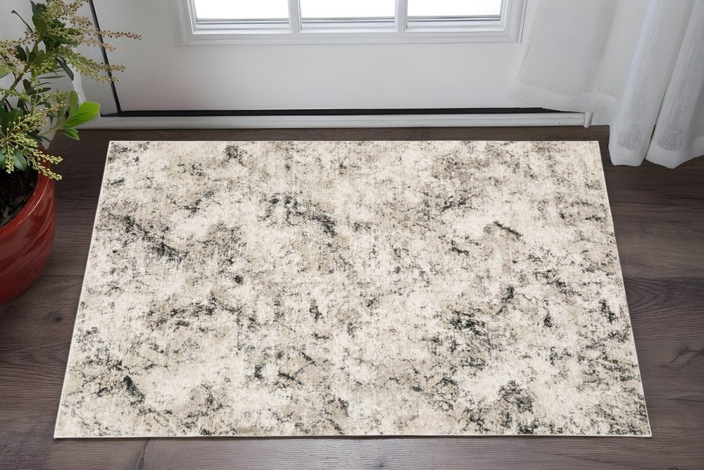 3' X 5' Ivory Grey Black Beige And Tan Abstract Power Loom Stain Resistant Area Rug