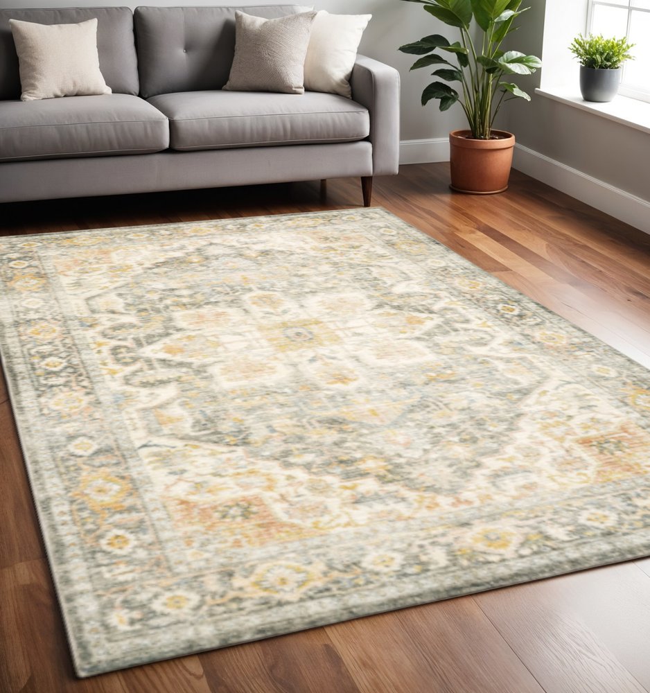 5' X 7' Grey Gold Orange And Ivory Oriental Power Loom Stain Resistant Area Rug