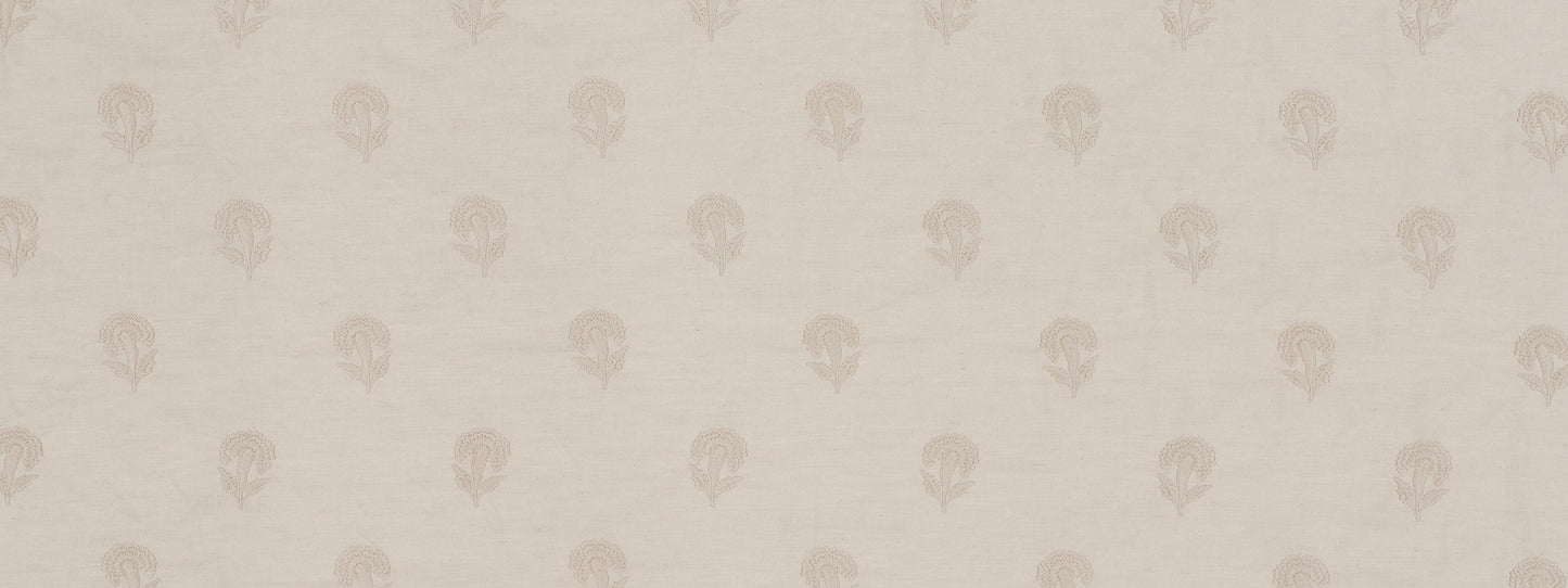 Oyster fabric with a tiny pale skull motif in a repeating pattern; soft textile for apparel or home decor.